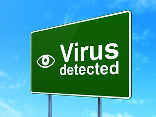 Image showing Security concept: Virus Detected and Eye on road sign background