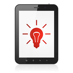 Image showing Finance concept: Light Bulb on tablet pc computer