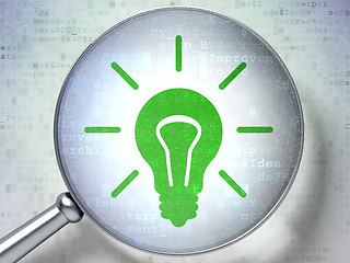 Image showing Finance concept: Light Bulb with optical glass on digital background