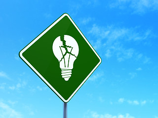 Image showing Finance concept: Light Bulb on road sign background