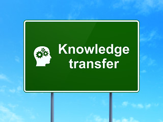Image showing Education concept: Knowledge Transfer and Head With Gears on road sign background