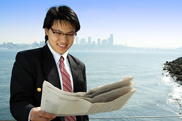 Image showing Reading businessman