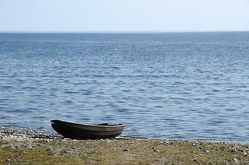 Image showing Old rowing boat at seaside