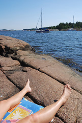 Image showing Sea, sky and legs