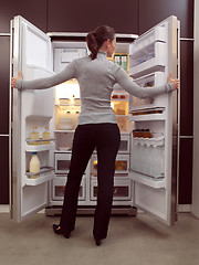 Image showing woman looking for something to eat