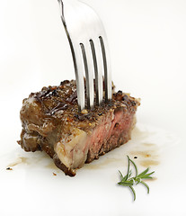 Image showing Piece Of Red  Meat Steak On A Fork