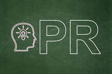 Image showing Advertising concept: Head With Lightbulb and PR on chalkboard background