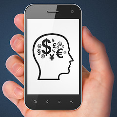 Image showing Education concept: Head With Finance Symbol on smartphone