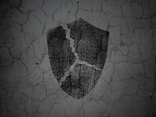 Image showing Privacy concept: Broken Shield on grunge wall background