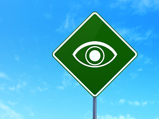 Image showing Protection concept: Eye on road sign background