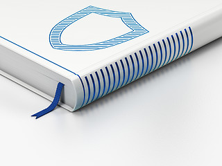 Image showing Closed book, Contoured Shield on white background