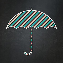 Image showing Safety concept: Umbrella on chalkboard background