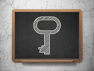 Image showing Protection concept: Key on chalkboard background