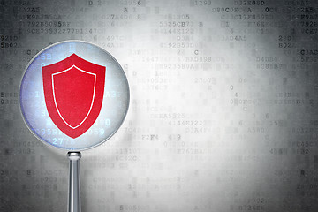 Image showing Privacy concept:  Shield with optical glass on digital background