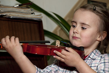 Image showing cute little gilr with violin- first step