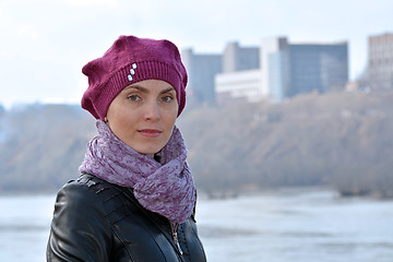 Image showing Woman in a red beret and a black jacket