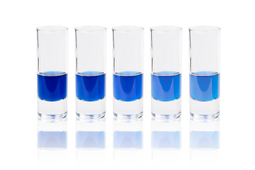 Image showing Six glasses with blue liquid