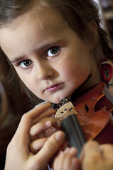 Image showing adorable little girl learning violin playing
