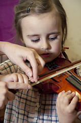 Image showing preschool child learning violin playing