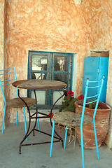 Image showing table and colorful old chairs