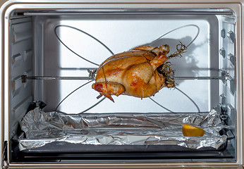 Image showing Spit-roasting chicken