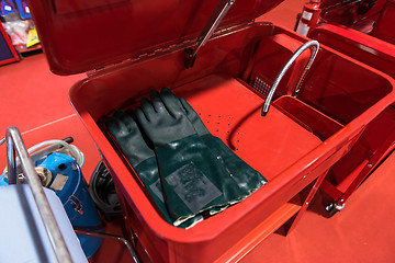 Image showing Protective gloves in red box