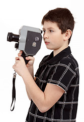 Image showing young boy with old vintage analog 8mm camera