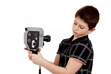 Image showing young boy with old vintage analog 8mm camera