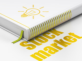 Image showing Business concept: book Light Bulb, Stock Market on white background
