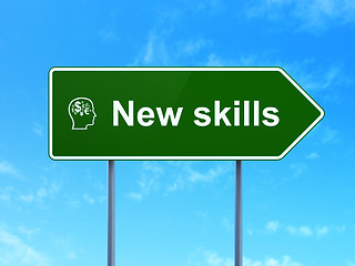 Image showing Education concept: New Skills and Head With Finance Symbol on road sign background