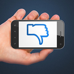 Image showing Social network concept: Thumb Down on smartphone