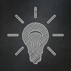 Image showing Finance concept: Light Bulb on chalkboard background