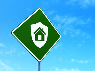 Image showing Safety concept: Shield on road sign background