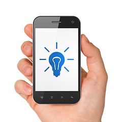 Image showing Finance concept: Light Bulb on smartphone