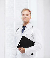 Image showing male doctor with stethoscope and notes