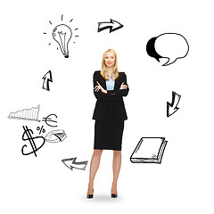 Image showing young smiling businesswoman with crossed arms