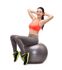 Image showing teenage girl doing exercise on fitness ball