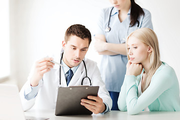 Image showing doctor and nurse with patient in hospital