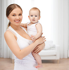 Image showing happy mother with adorable baby