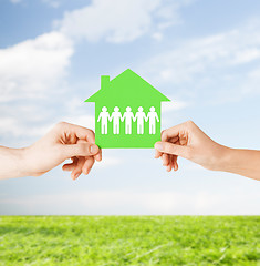 Image showing man and woman hands with paper house