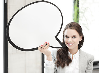 Image showing smiling businesswoman with blank text bubble