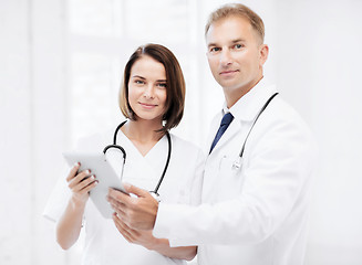 Image showing two doctors looking at tablet pc