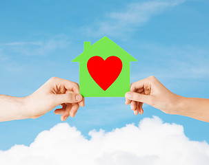 Image showing couple hands holding green paper house