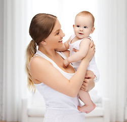 Image showing happy mother with adorable baby