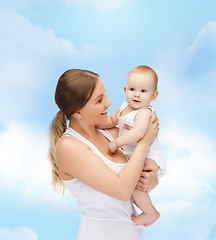 Image showing happy mother with adorable baby