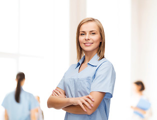Image showing smiling female doctor or nurse