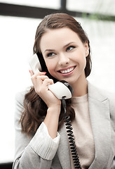 Image showing businesswoman with cell phone calling