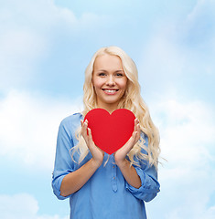 Image showing smiling woman with red heart