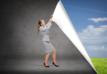 Image showing smiling businesswoman changing sceneries