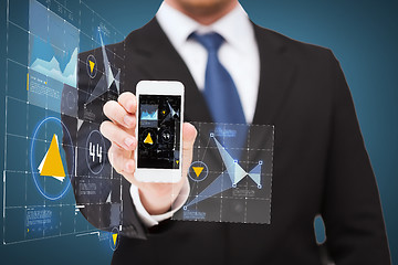 Image showing businessman showing smartphone with virtual screen